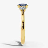 "Bluzz" Round Cut 1.5 Carat Blue Sapphire Trilogy Yellow Gold Engagement Ring Render- Side View