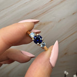 "Bluzz" Round Cut 1.5 Carat Blue Sapphire Trilogy Yellow Gold Engagement Ring 3SRB51