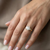"Lunar" Emerald Cut 3 carat Diamond Shoulder 18kt Yellow Gold Engagement Ring
