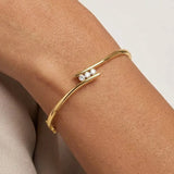 ROUND DIAMOND 0.36 CARAT THREE STONE CROSS OVER BANGLE