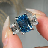 "Zylaris" Blue Sapphire 3.01 Carat Emerald Cut Trilogy Lab Grown Diamond Engagement Ring HLM38 HEERA DIAMONDS