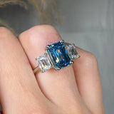 "Zylaris" Blue Sapphire 3.01 Carat Emerald Cut Trilogy Lab Grown Diamond Engagement Ring HLM38 HEERA DIAMONDS