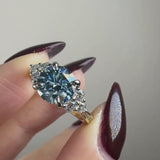 "Kiara" Round Cut Blue Diamond 2.5 Carat Lab Grown Diamond Shoulder Yellow Gold Engagement Ring