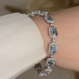 Emerald Shape 11 Carat Aquamarine Tennis Bracelet Featuring Diamond Halo BRHAEC