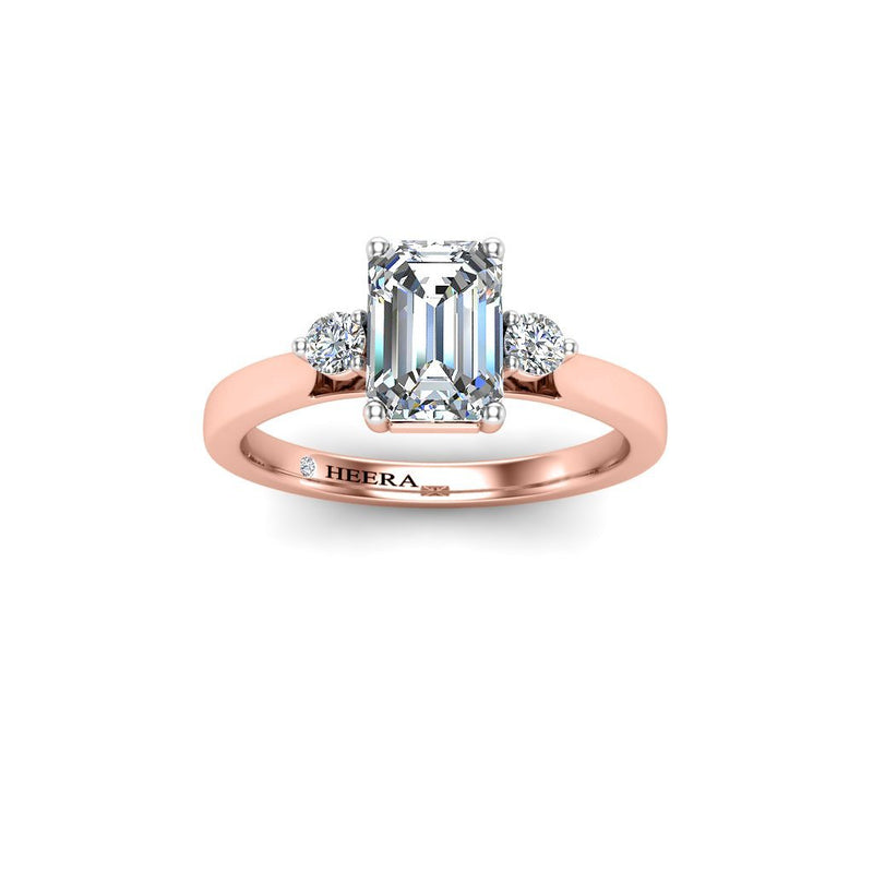 BAYSENBERRY - Emerald cut and Round Brilliants Trilogy Engagement Ring in Rose Gold - HEERA DIAMONDS