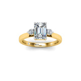 BAYSENBERRY - Emerald cut and Round Brilliants Trilogy Engagement Ring in Yellow Gold - HEERA DIAMONDS